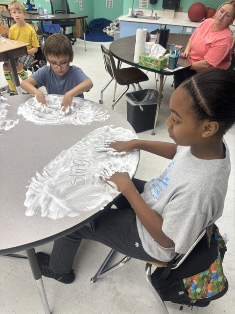 Mr. Geer's class working on sensory spelling