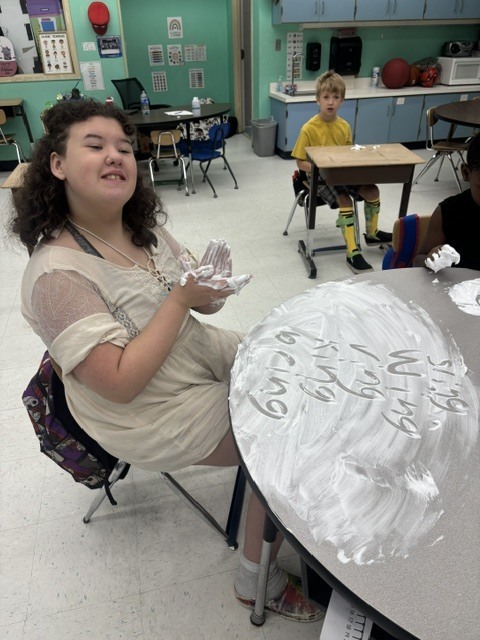 Mr. Geer's class working on sensory spelling