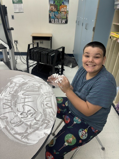 Mr. Geer's class working on sensory spelling