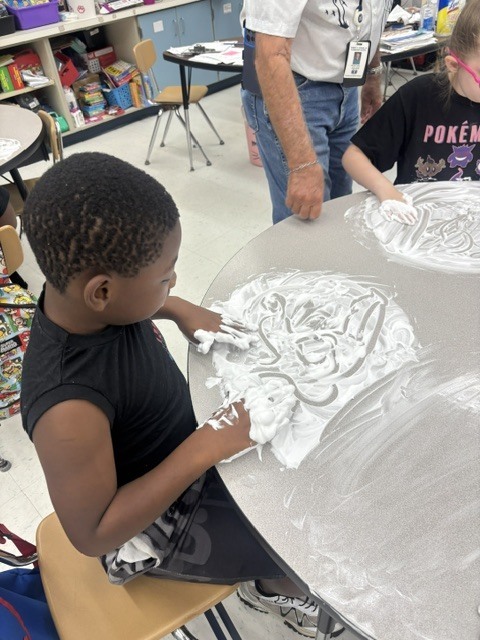 Mr. Geer's class working on sensory spelling