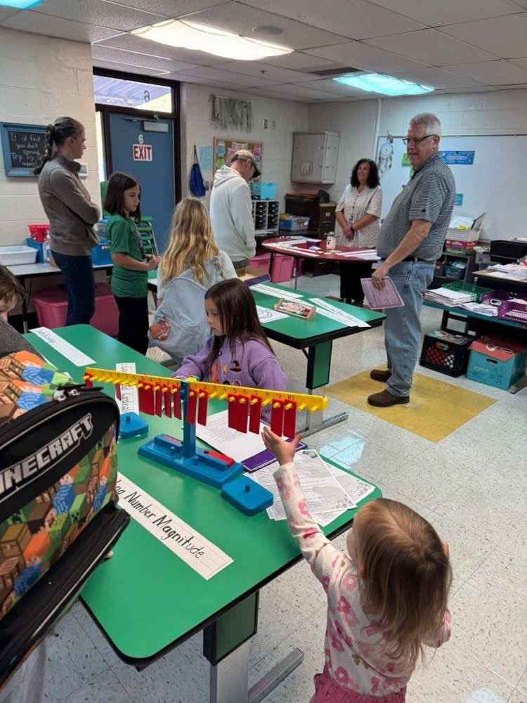 families playing with math manipulatives 