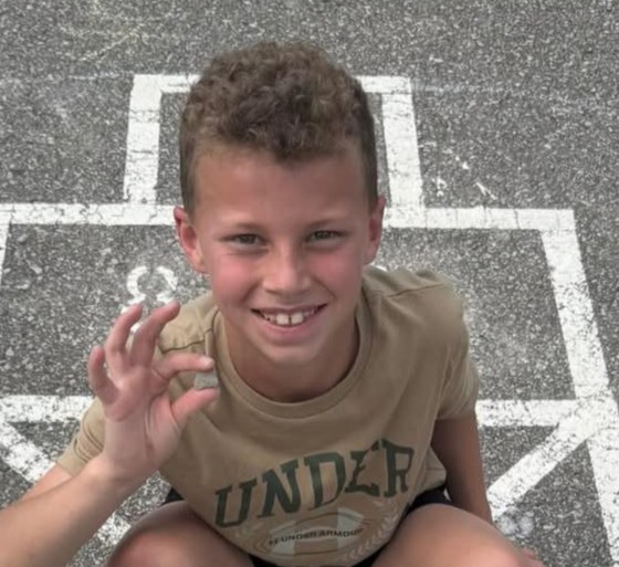 boy in hopscotch board 