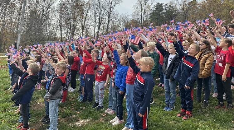 kids waving the American flag