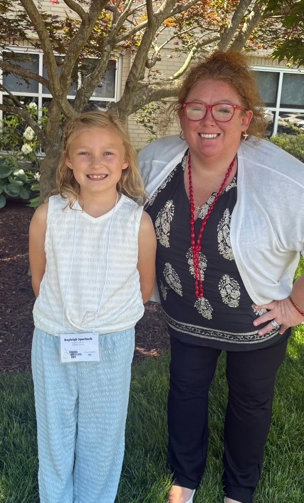3rd grader with her teacher