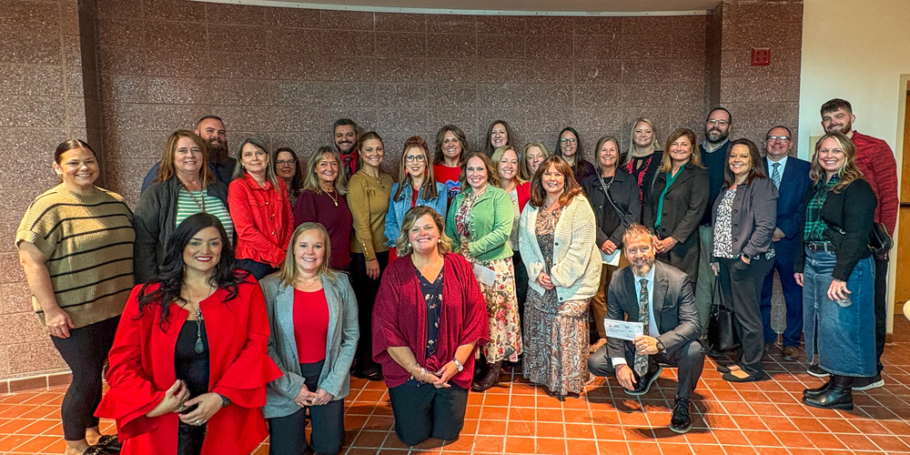 PCS administrators and staff receive donations for their school’s virtual pantries at the “Keep the Ball Rolling” Celebration.