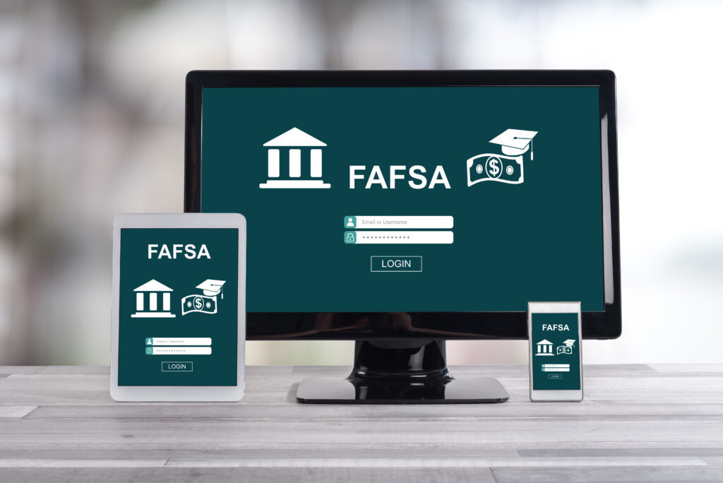 photo of electronic devices showing a FAFSA login page