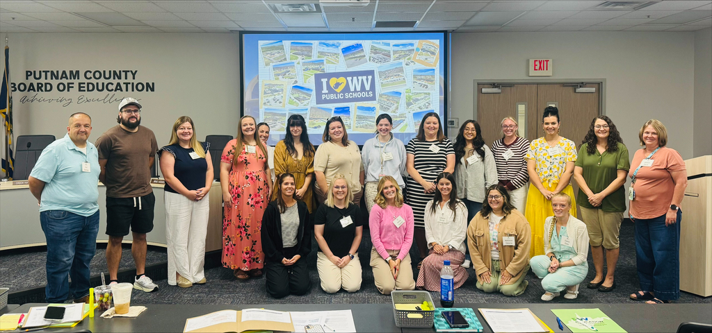 New ly hired teachers to PCS in group photo.