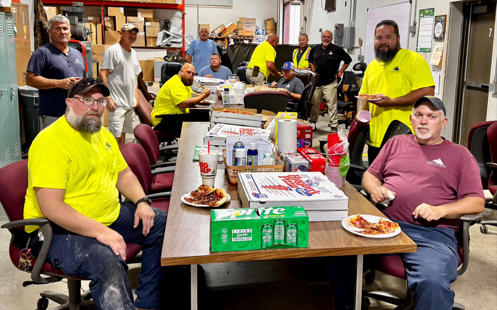 PCS Maintenance workers enjoy pizza from Sunbelt Rentals