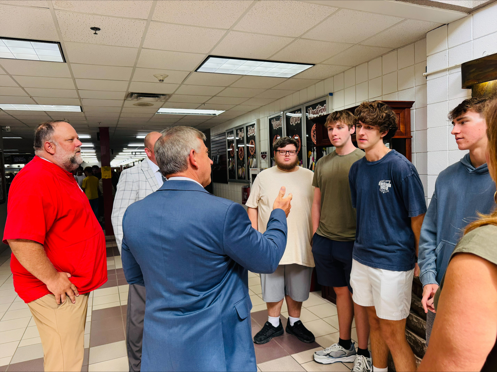 Mr. McGrew talks with finalist about future college plans. 