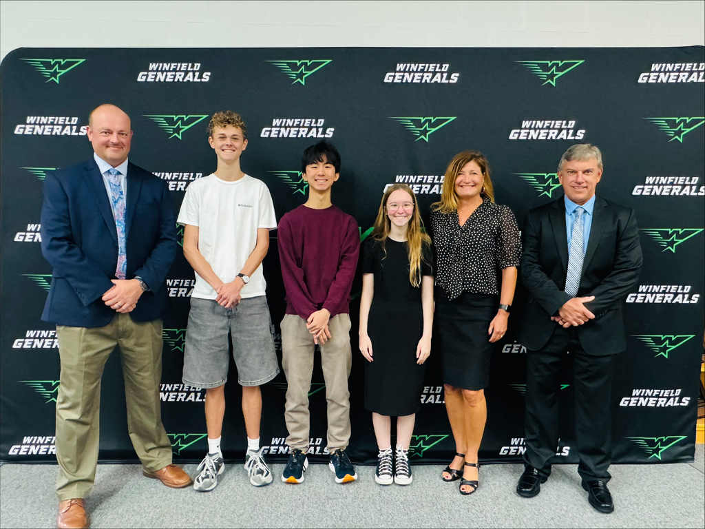 Mr. McGrew with three National Merit Semifinalist 