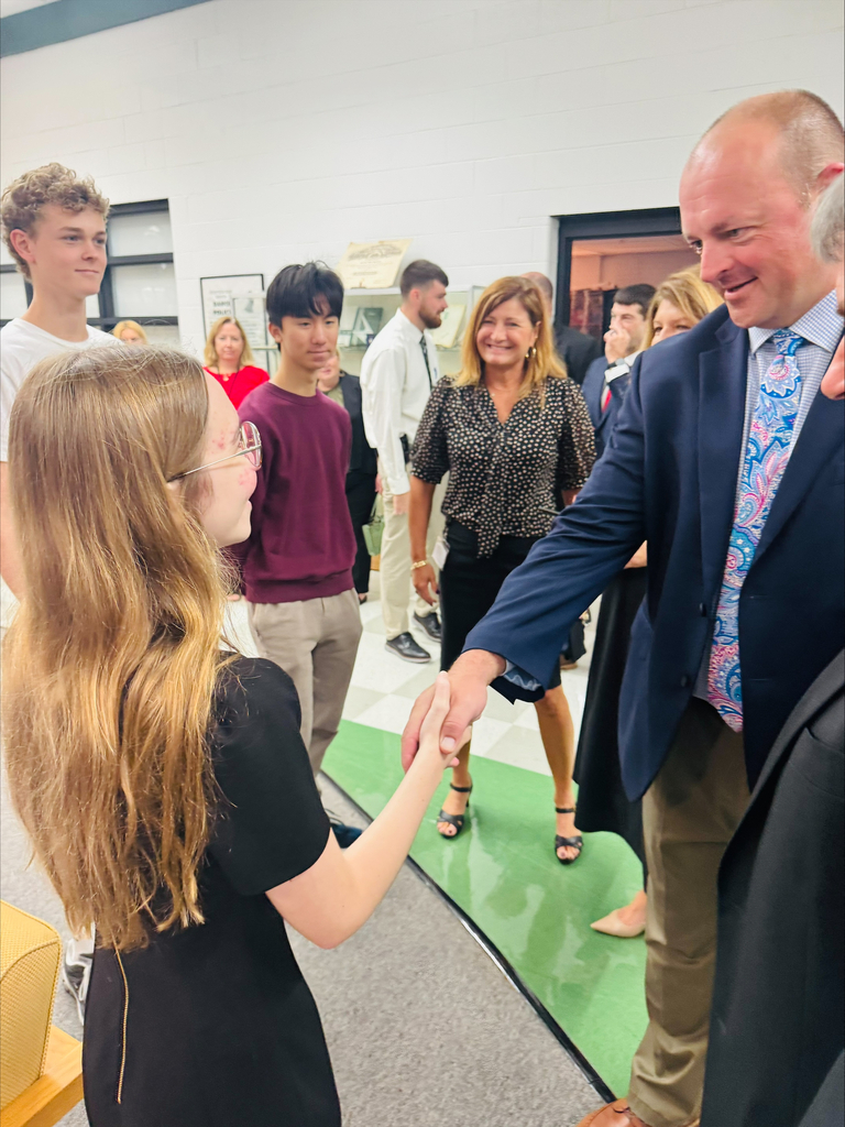 Mr. McClanahan congratulates student on becoming National Merit Semifinalist. 