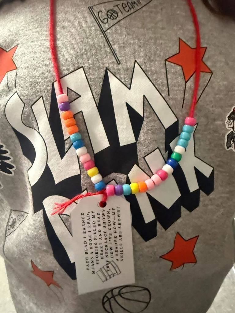 Each student’s necklace tells a story 📖✨ Every bead represents a book read, and today Mrs. Simmers’ second graders created their very own reading necklaces to celebrate their hard work and growth as readers. Watching their pride as they added each bead was so special! This small incentive has already sparked big motivation, and I can’t wait to see how many books they read during the second half of the school year. So proud of these readers! 📚💙  #puxicolearns