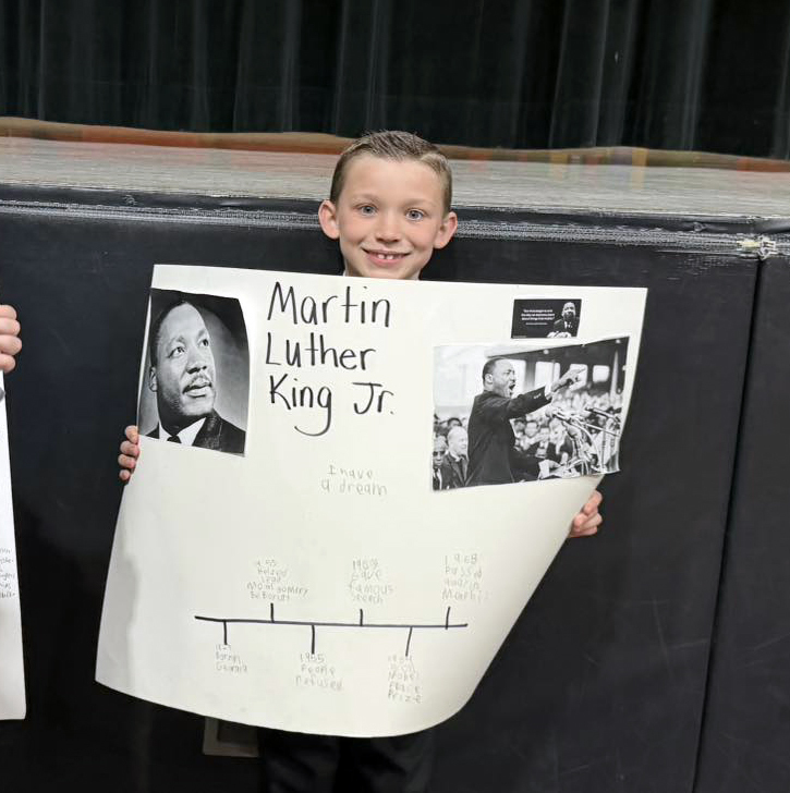Our 2nd graders brought history to life with their very own Living Wax Museum! 🖤🧡 Students researched historical figures and teamed up with our 4th graders to create speeches and posters. They proudly presented their projects to the entire elementary school and then wowed our community with an evening performance! We are incredibly proud of the hard work, confidence, and collaboration these students demonstrated. What an amazing learning experience! A big THANK YOU to our 2nd grade teachers for creating such a meaningful and engaging opportunity for our students. 👏 Great job, everyone!