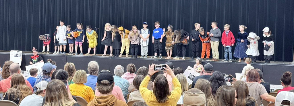 Our 2nd graders brought history to life with their very own Living Wax Museum! 🖤🧡 Students researched historical figures and teamed up with our 4th graders to create speeches and posters. They proudly presented their projects to the entire elementary school and then wowed our community with an evening performance! We are incredibly proud of the hard work, confidence, and collaboration these students demonstrated. What an amazing learning experience! A big THANK YOU to our 2nd grade teachers for creating such a meaningful and engaging opportunity for our students. 👏 Great job, everyone!