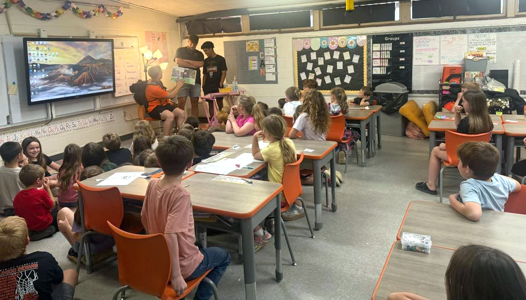 Jett, Landan, and Will reading to children