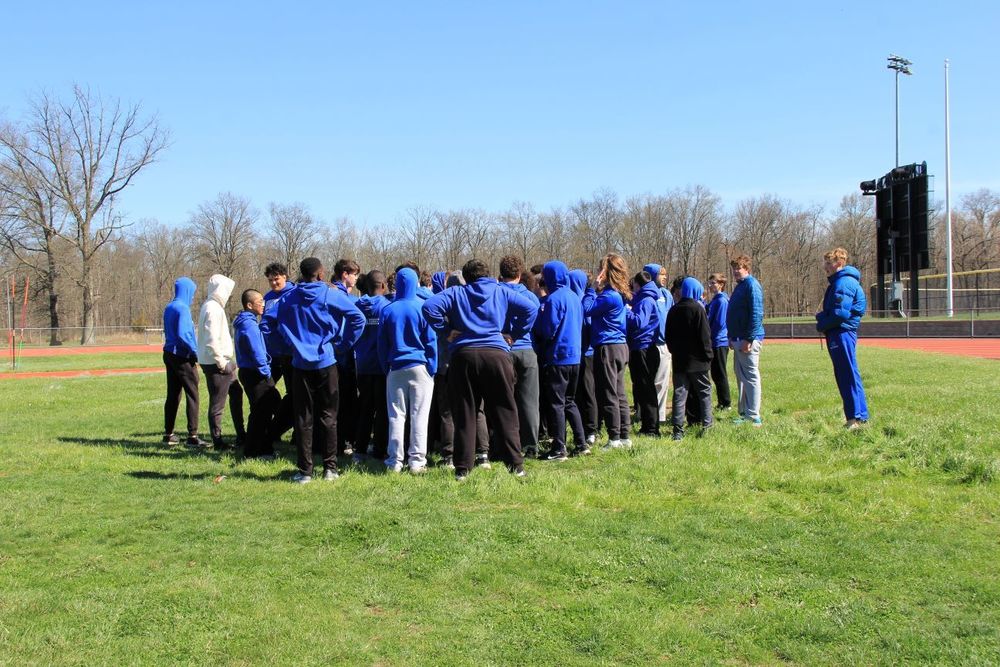 The team huddles up before the track meet!