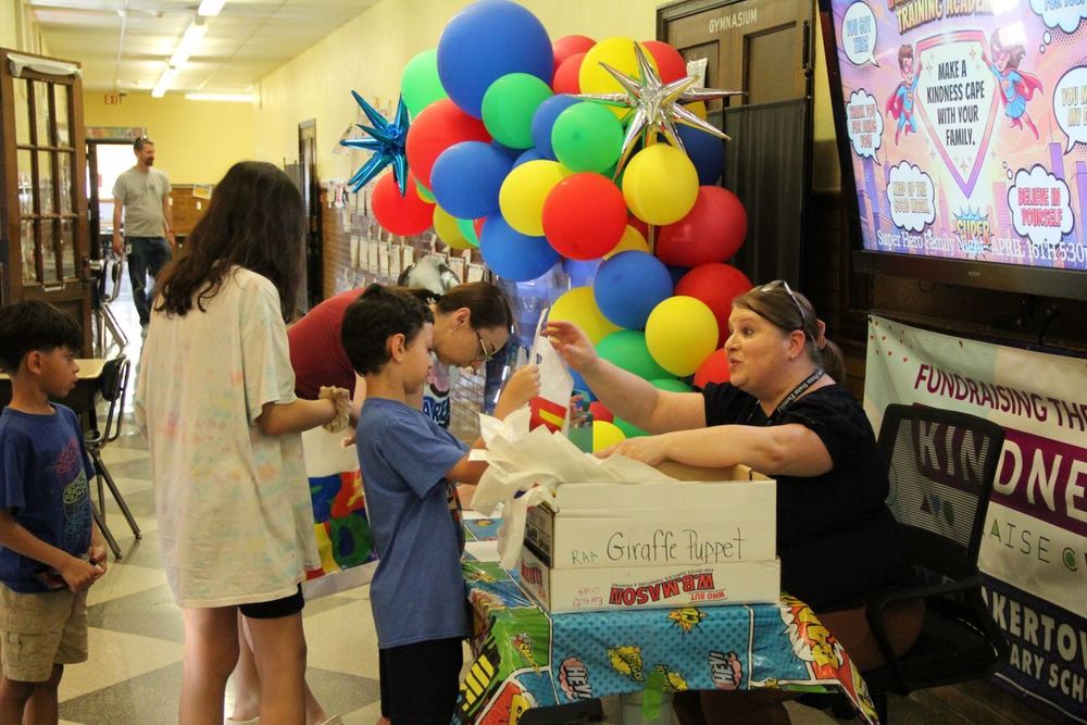 Super Hero Night at Quakertown Elementary - Teachers welcome families to Super Hero Night 