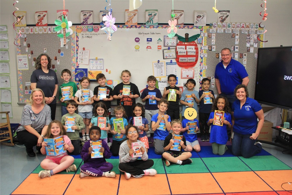 Pfaff First Graders with their new books from QCEF