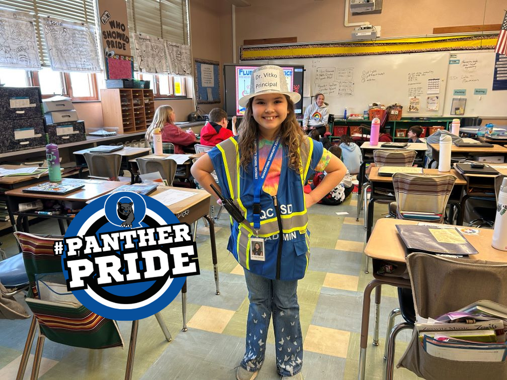 Grace poses for a photo in her "Prinicpal for a Day" outfit