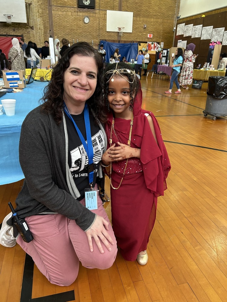 Dr. Bubser poses for a photo with a student at Cultures Day