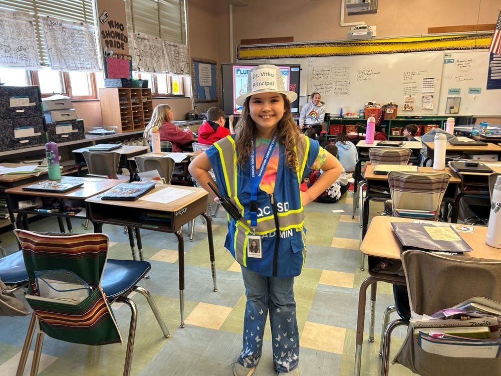 Third Grade Student, Grace, posing in her "Principal for a Day" outfit.