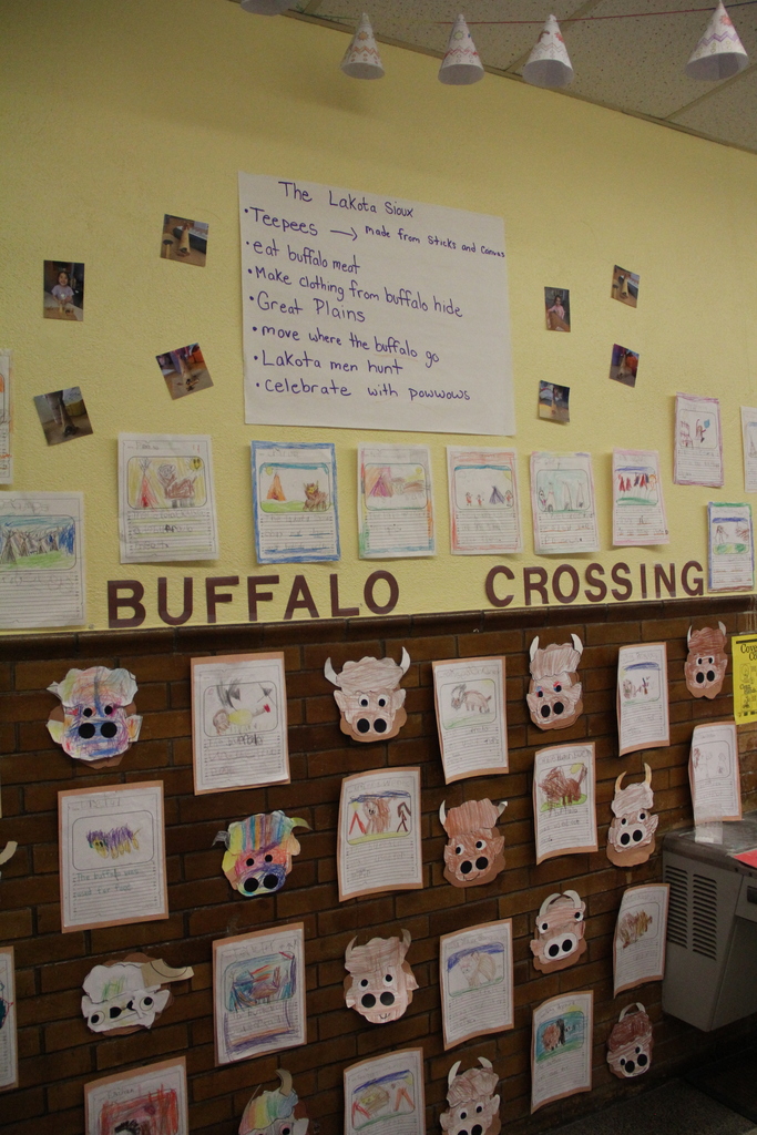 The Kindergarteners at QE are currently learning about the Lakota Sioux—the indigenous people of the Great Plains, and how the buffalo were essential to their survival and spiritual life. They learned that the buffalo were their primary source of food, clothing, and shelter. Students created teepees made of sticks and canvas and created artwork to decorate the halls of QE.
