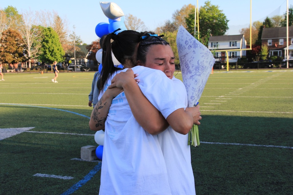 The senior players hugging.