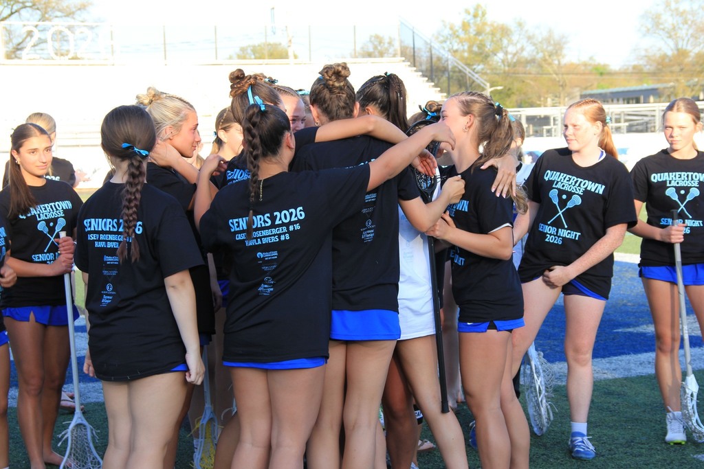 The team hugging the seniors.