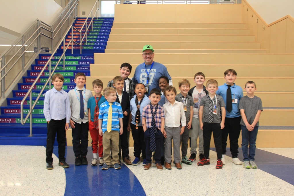 Mr. Godshalk smiles with all his 'Mini" Godshalks