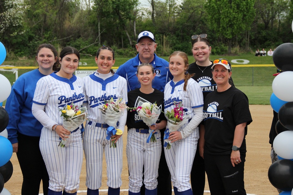 Our seniors smile with their coaches