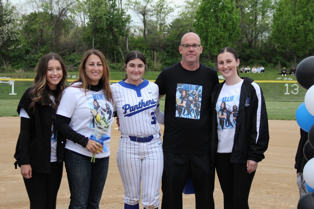 Ellie Hilton smiles with her family