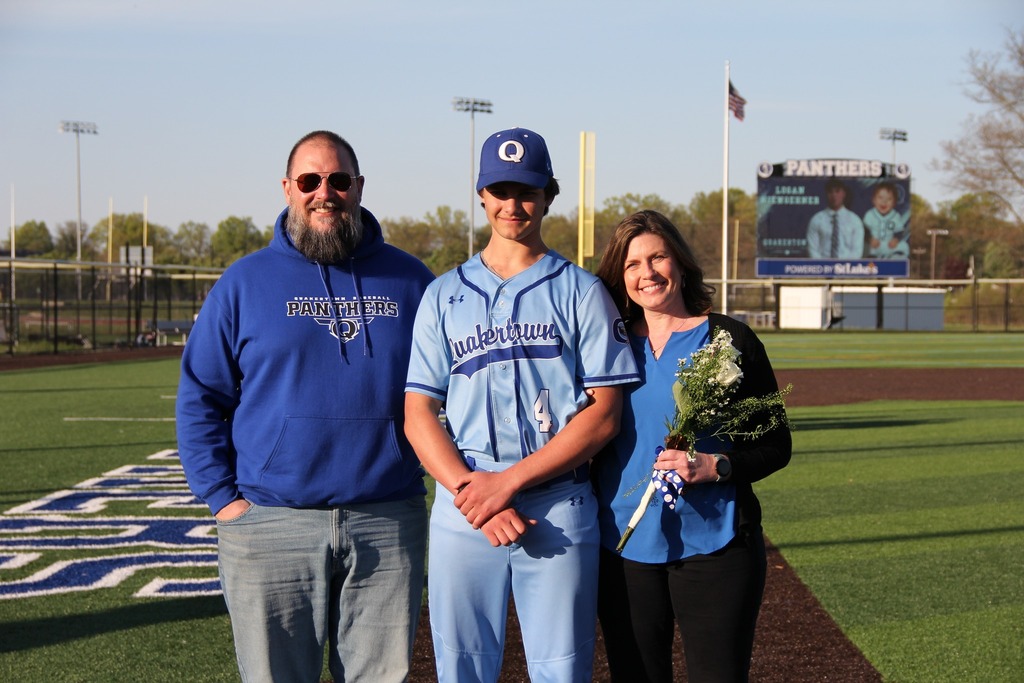 Seniors smile with their families.