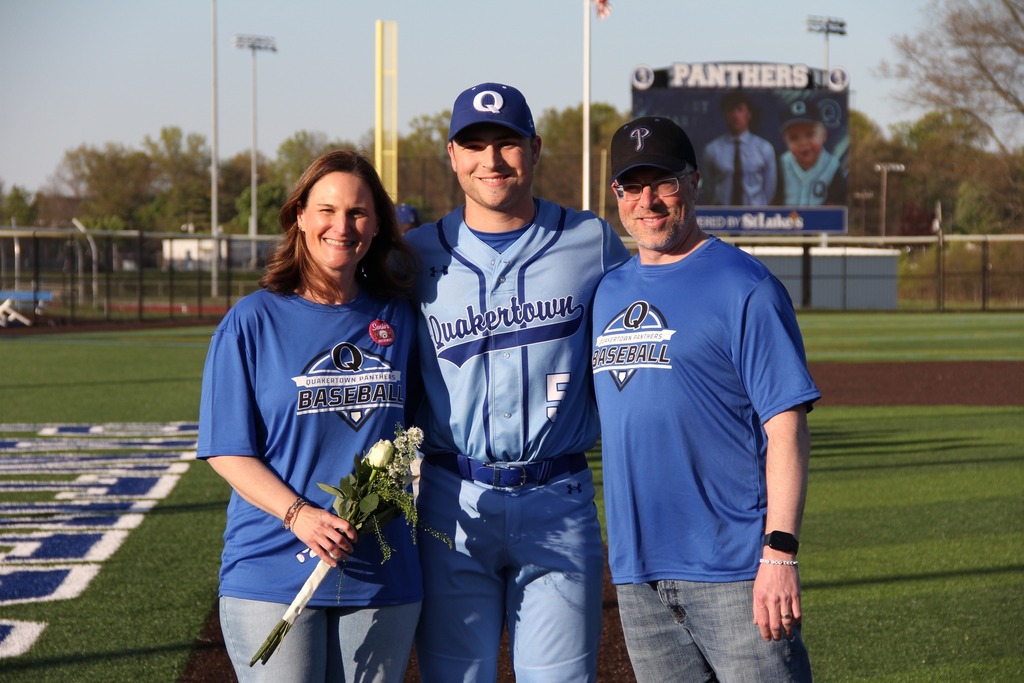 Seniors smile with their families.