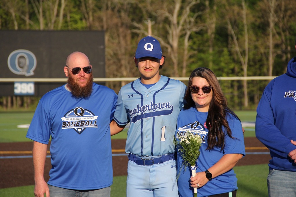 Seniors smile with their families.