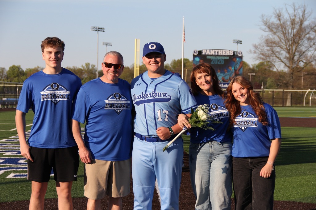 Seniors smile with their families.