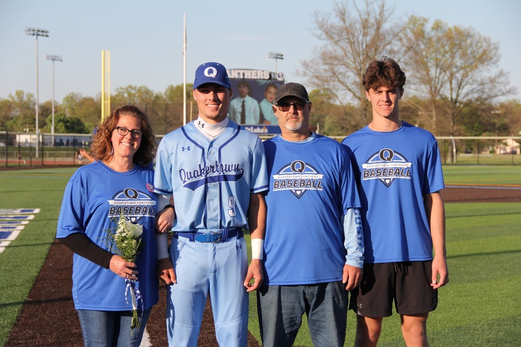 Seniors smile with their families.