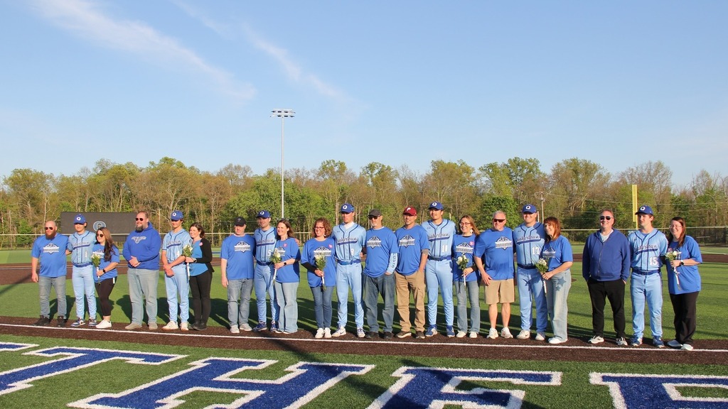 Seniors smile with their families.