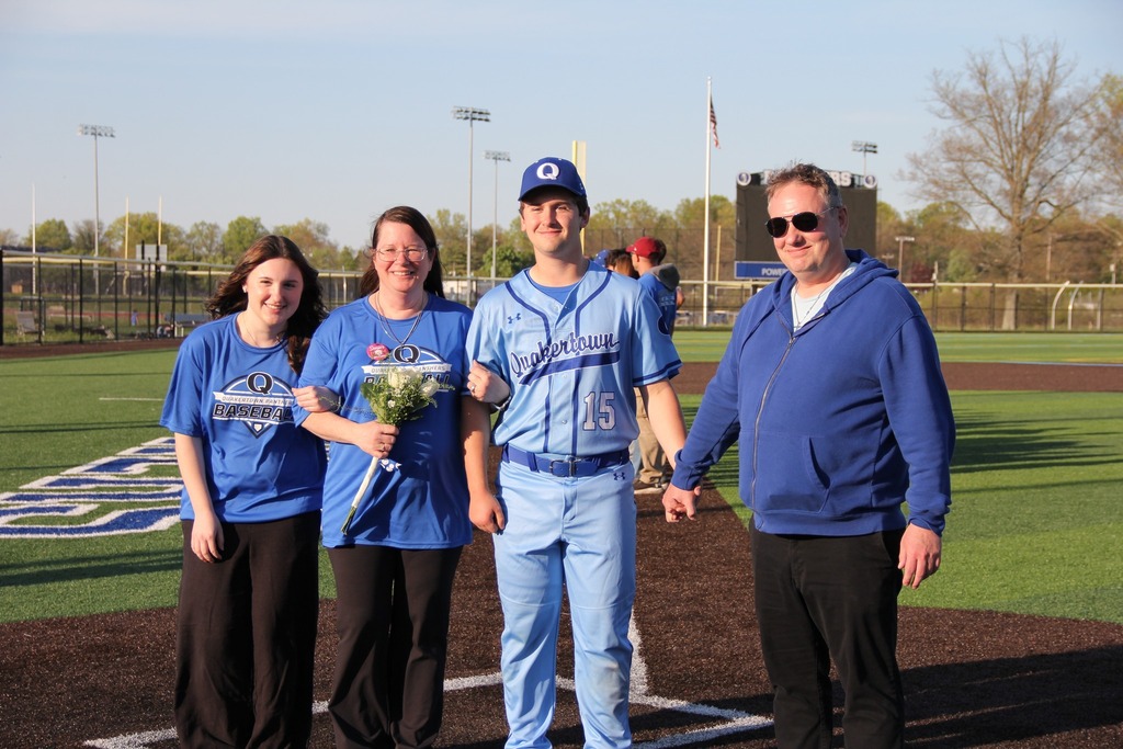 Seniors smile with their families.