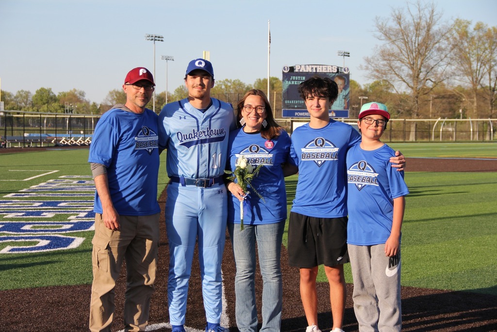Seniors smile with their families.
