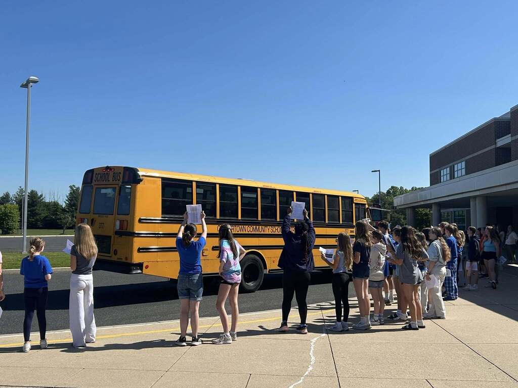 Buses arrive at Strayer with the 6th Grade students