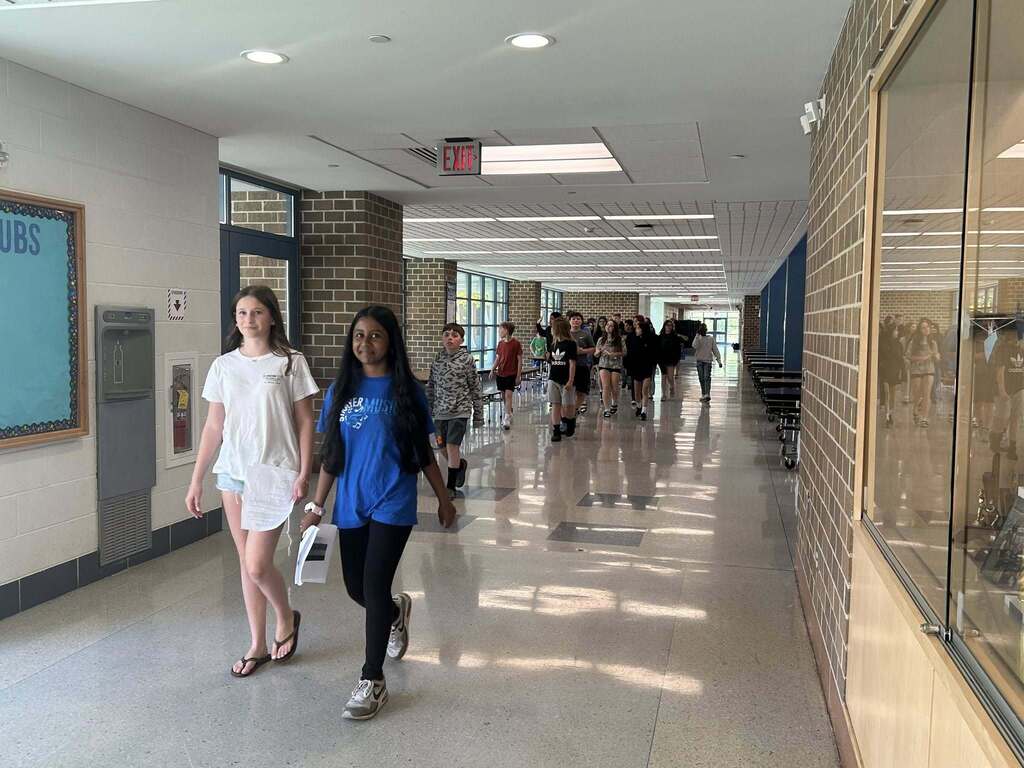 Strayer students lead sixth graders on a tour of the school