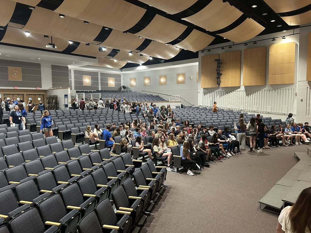 Sixth Grade students arrive at the Strayer Auditorium