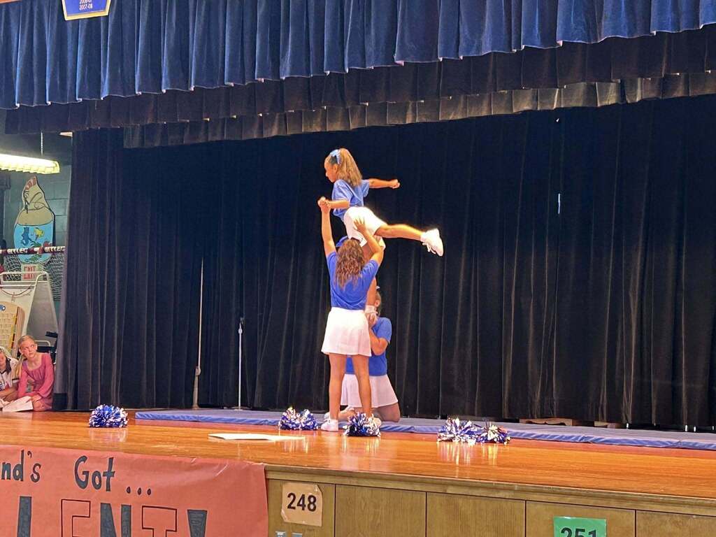 Students perform a dance on the stage at Richland