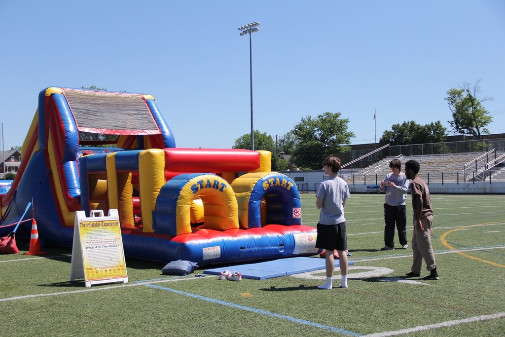 Students prepare to race in an inflatable obstacle course