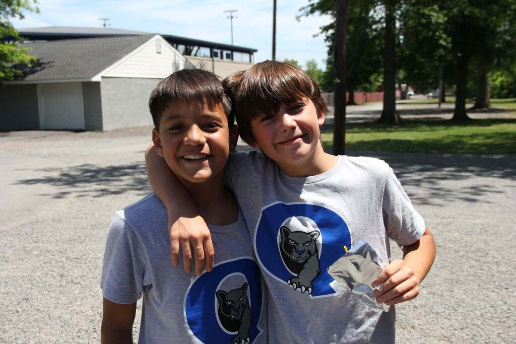 Two 5th grade boys smile for a photo