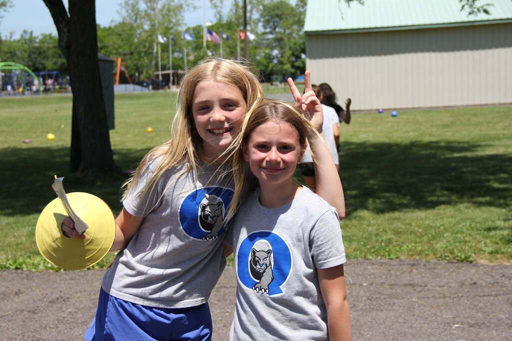 Two 5th grade girls smile for a photo
