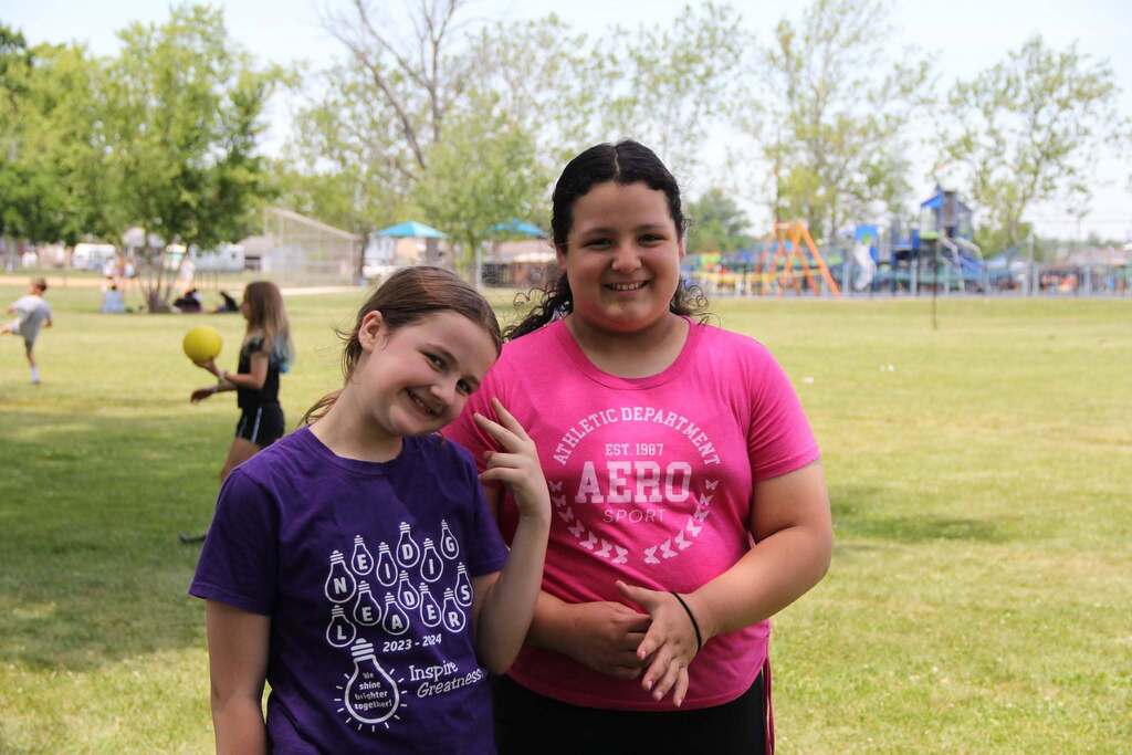 Two 5th grade girls smile for a photo