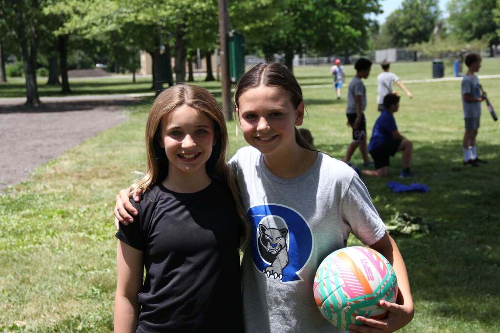 Two 5th grade girls smile for a photo