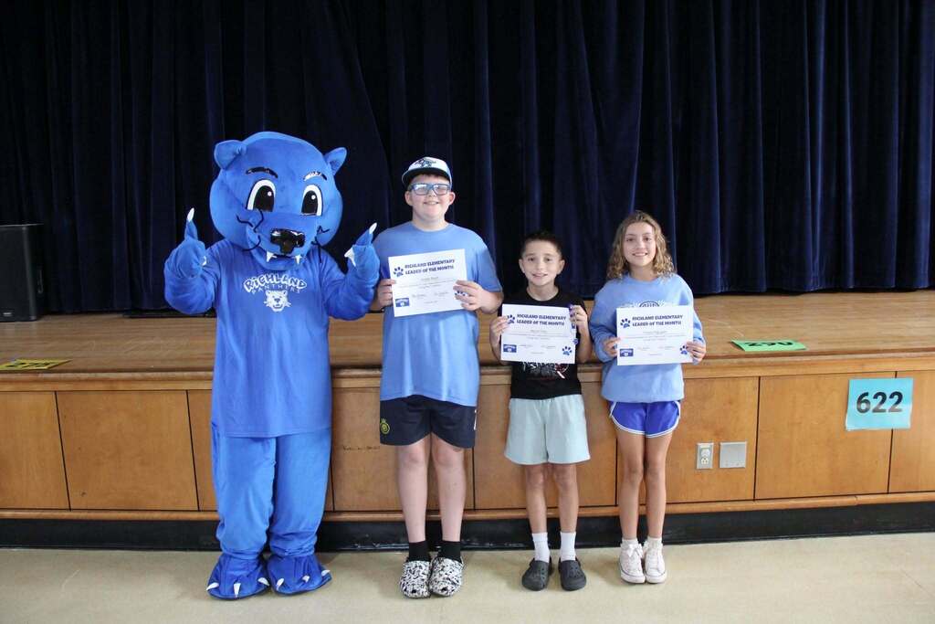 Student Leaders smile with their Leadership Certificates with Richie the Panther Mascot