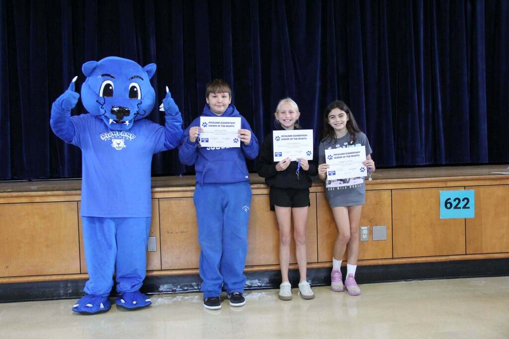 Student Leaders smile with their Leadership Certificates with Richie the Panther Mascot